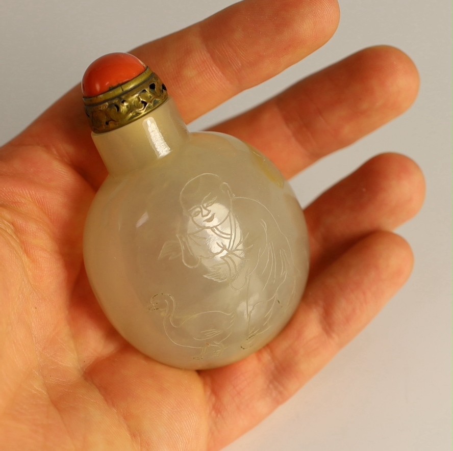 A Chinese agate ‘boys’ snuff bottle, 19th century 5.5cm high, brass and coral stopper